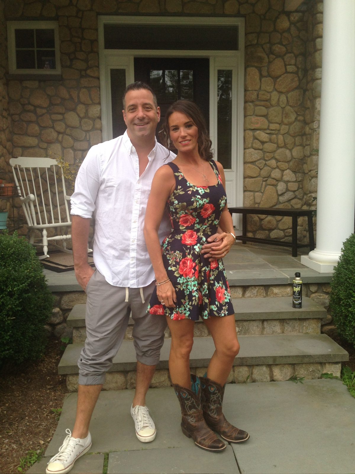 On the front steps of the stone house