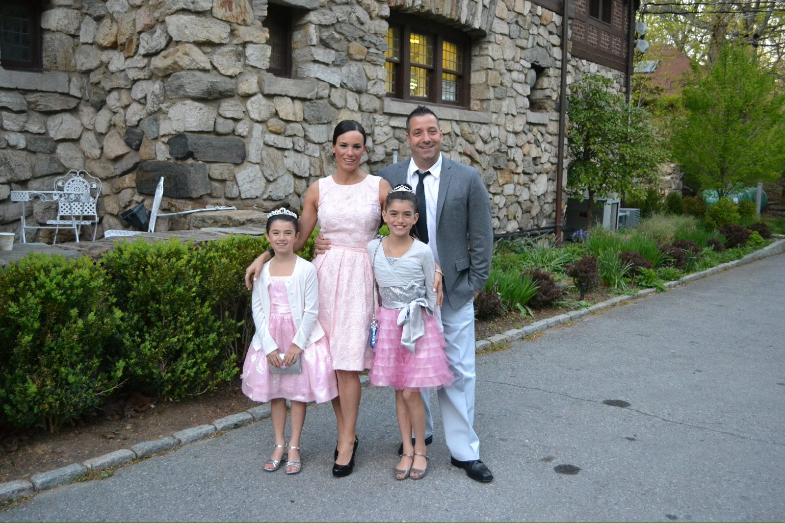 The four of them outside a stone house in the Norwalk years