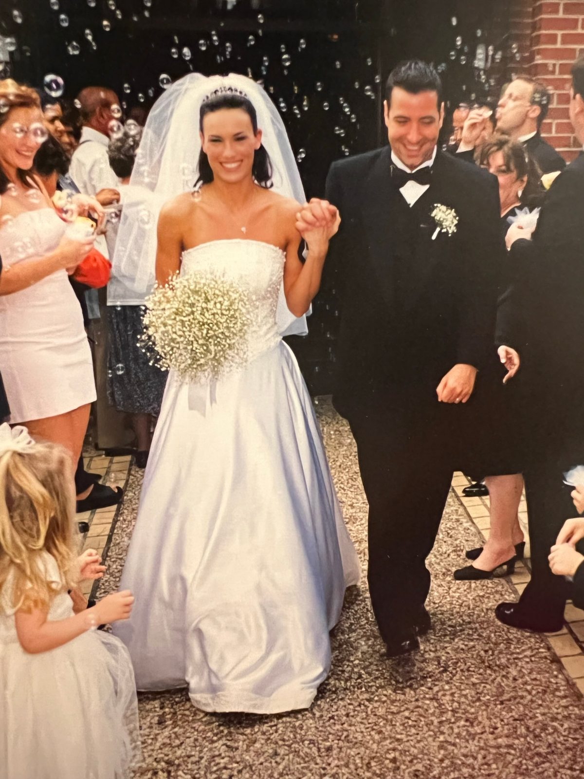 Heidi and Marc walking out of their wedding through bubbles, May 2000